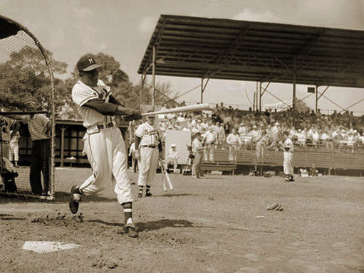 Eddie Mathews of the Milwaukee Braves swings at the pitch during an
