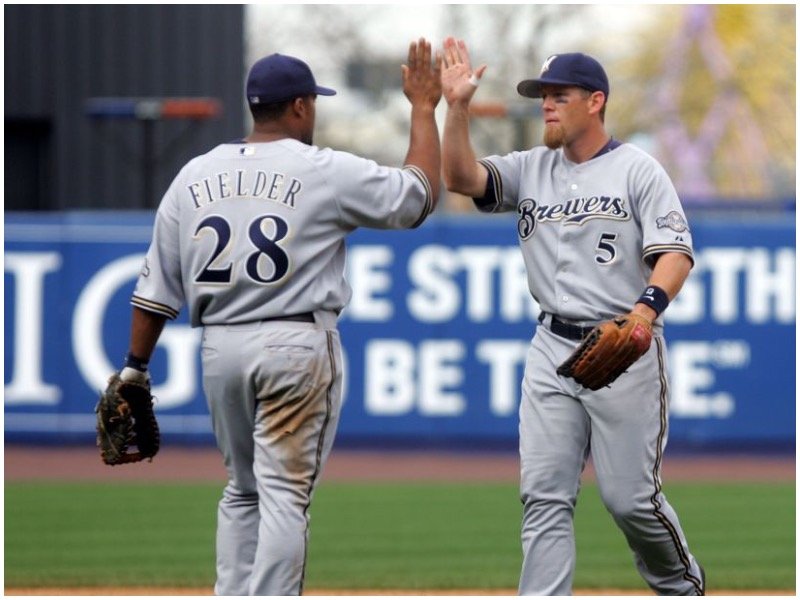 Milwaukee Brewers Prince Fielder walks off the field with wife