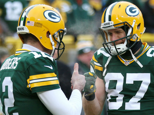 Green Bay Packers receiver Jordy Nelson (87) and quarterback Aaron Rodgers  (12) are all smiles after the two teamed up for a touchdown against the  Chicago Bears in the fourth quarter at