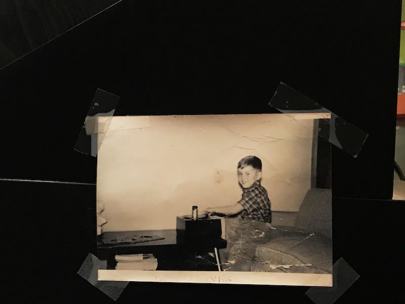 A picture of Gill as a youth taped up in the studio.
