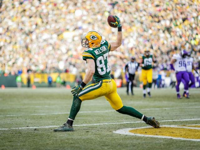 Green Bay Packers receiver Jordy Nelson (87) and quarterback Aaron Rodgers  (12) are all smiles after the two teamed up for a touchdown against the  Chicago Bears in the fourth quarter at